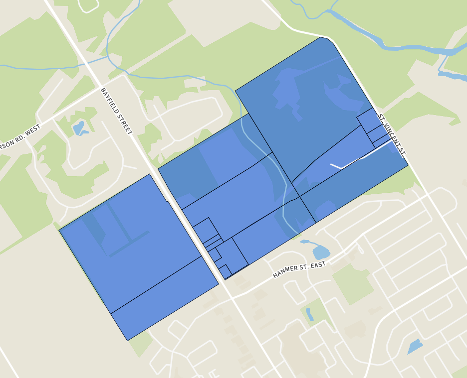 Map showing blue-highlighted growth and development lands near Bayfield Street, St. Vincent Street and Hanmer Street East, north of Barrie near the Springwater boundary